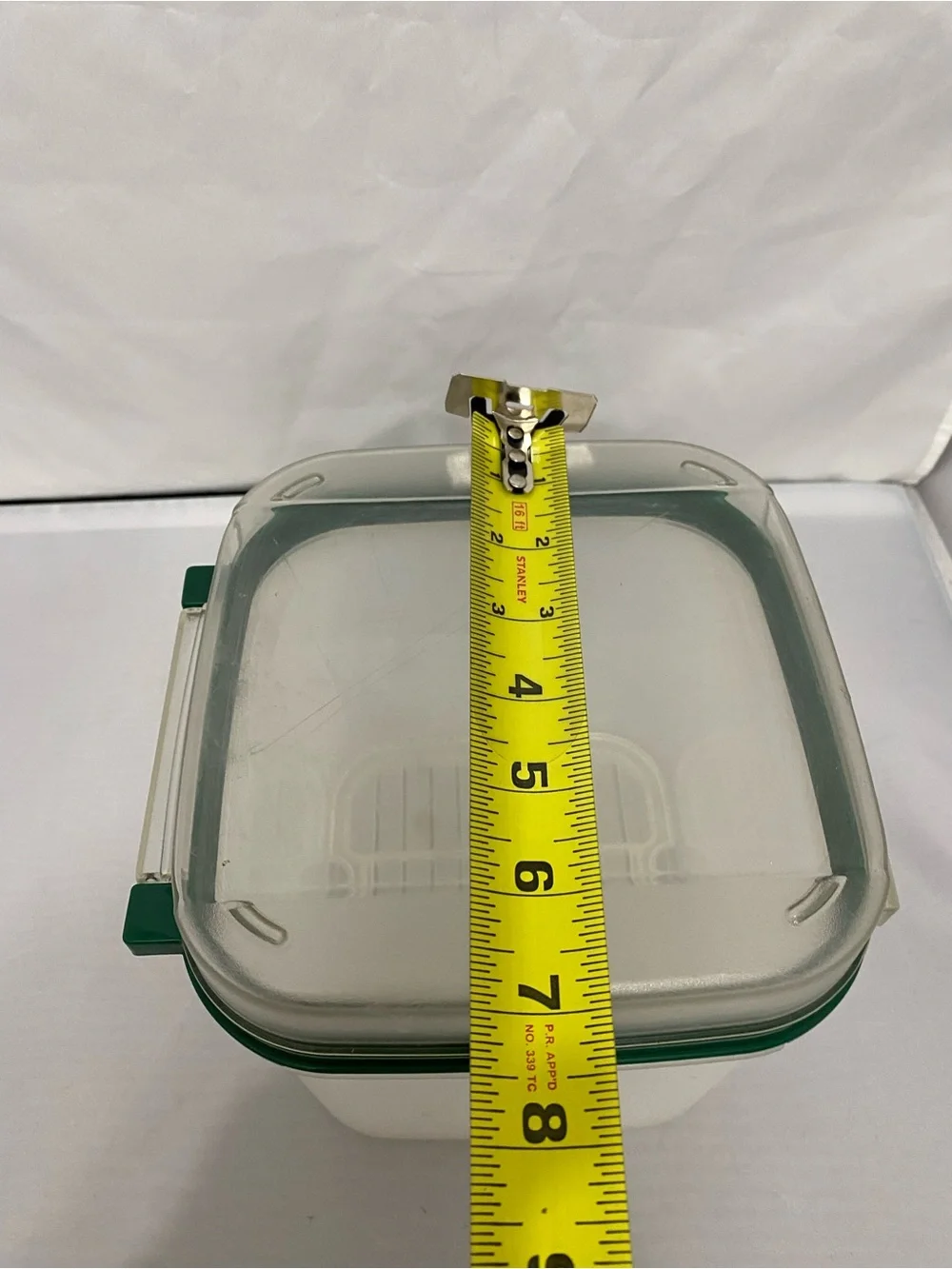 Tupperware Container with Green Rim and Flip Top Lid